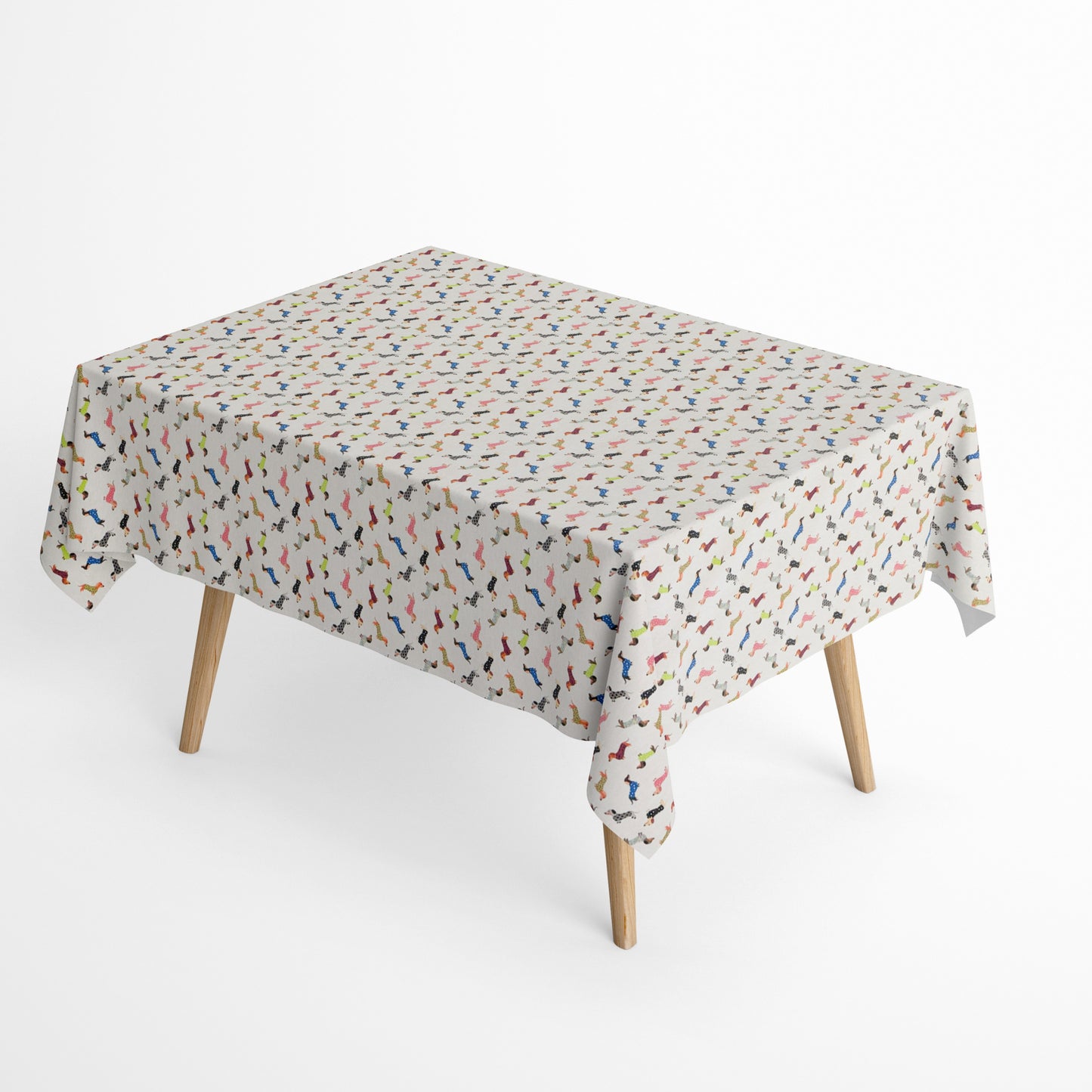 Jacquard Tischdecke aus beschichteter Baumwolle mit kleinem, buntem Dackel-Muster auf hellem Hintergrund, fleckenabweisend und pflegeleicht.