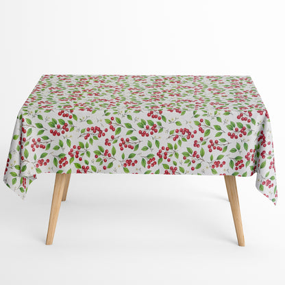 Jacquard Tischdecke aus beschichteter Baumwolle mit Kirschen, Kirschblüten und grünen Blättern auf hellem Hintergrund, fleckenabweisend und pflegeleicht.