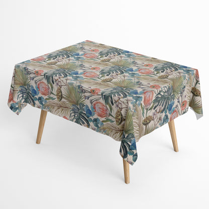 Beschichtete Jacquard-Baumwolltischdecke mit tropischem Pflanzenmotiv aus großen Blättern, exotischen Blüten und botanischen Elementen in Blau-, Grün-, Korall- und Naturtönen, fleckengeschützt und schmutzabweisend.