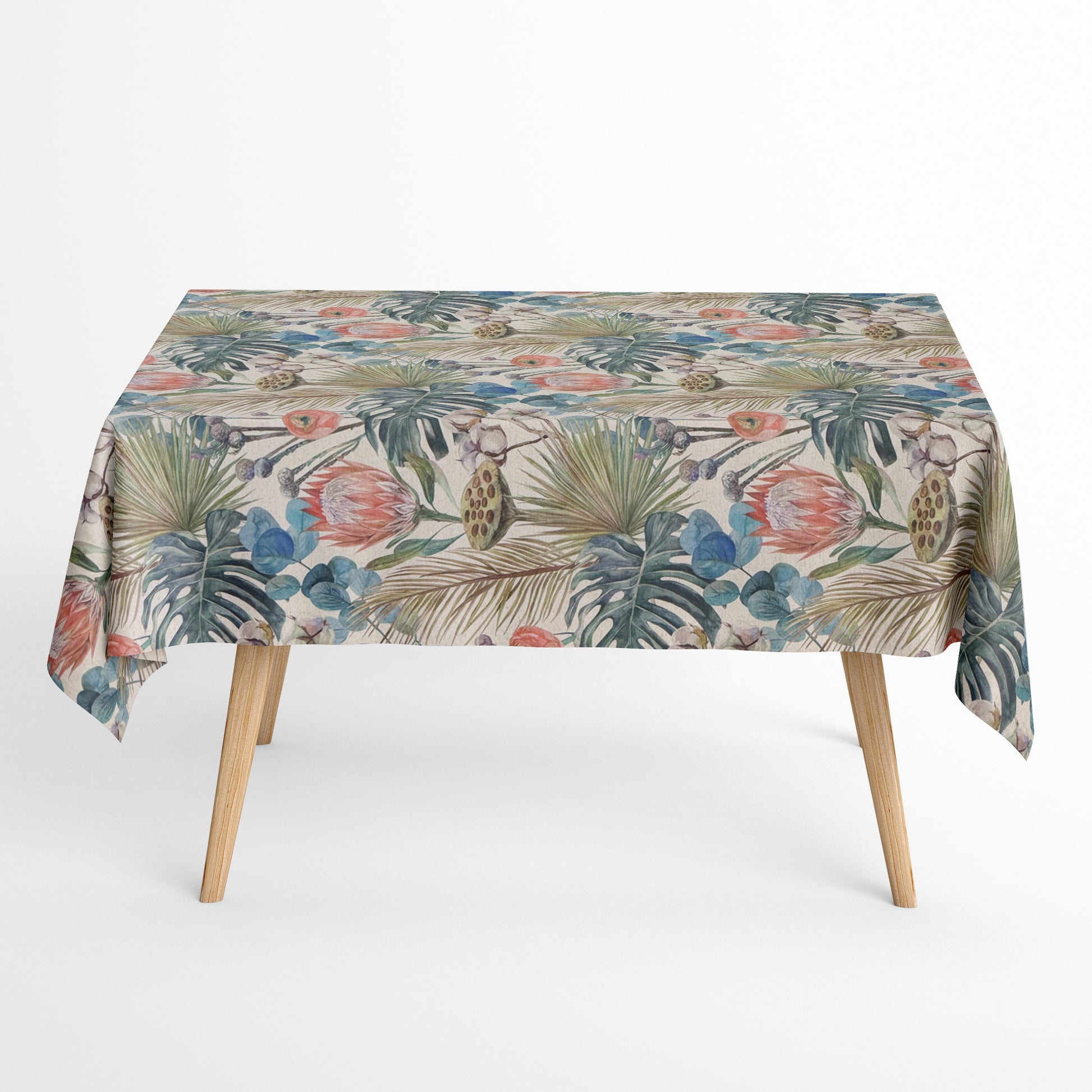 Beschichtete Jacquard-Baumwolltischdecke mit tropischem Pflanzenmotiv aus großen Blättern, exotischen Blüten und botanischen Elementen in Blau-, Grün-, Korall- und Naturtönen, fleckengeschützt und schmutzabweisend.