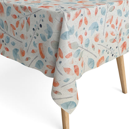 Beschichtete Jacquard-Baumwolltischdecke mit zartem Aquarell-Blättermuster in Koralle, Hellblau, Grau und Naturtönen, fleckengeschützt und schmutzabweisend.