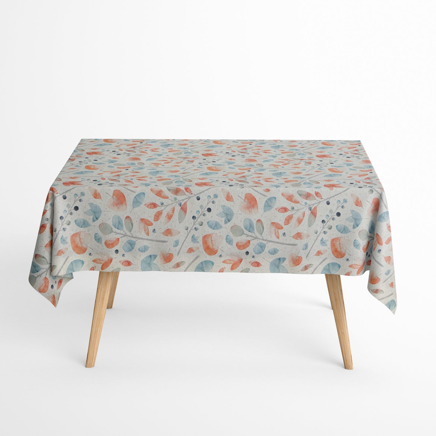 Beschichtete Jacquard-Baumwolltischdecke mit zartem Aquarell-Blättermuster in Koralle, Hellblau, Grau und Naturtönen, fleckengeschützt und schmutzabweisend.