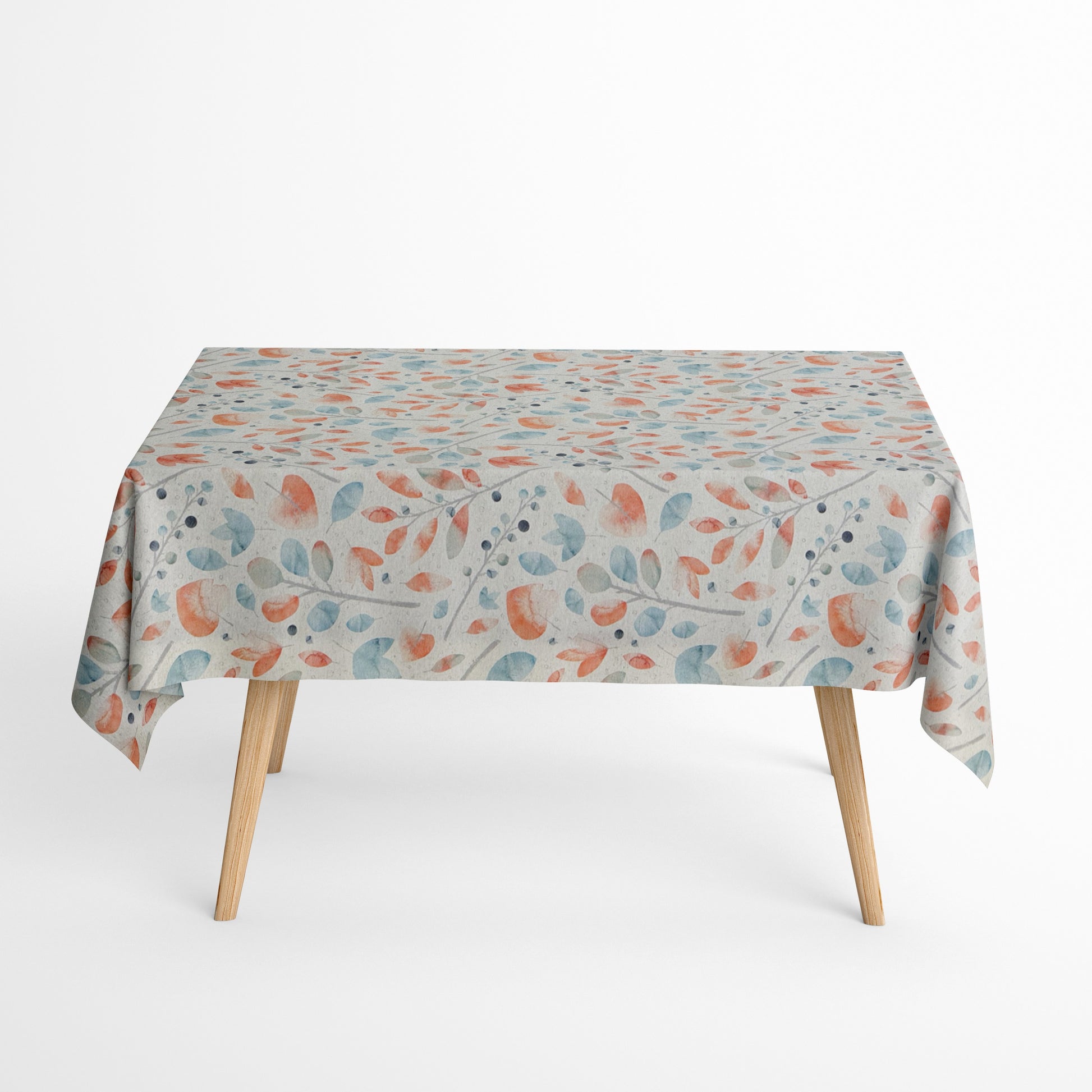 Beschichtete Jacquard-Baumwolltischdecke mit zartem Aquarell-Blättermuster in Koralle, Hellblau, Grau und Naturtönen, fleckengeschützt und schmutzabweisend.