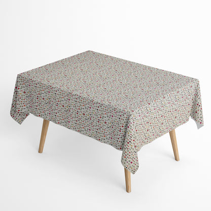 Beschichtete Jacquard-Baumwolltischdecke mit zartem Streublumenmuster aus kleinen bunten Blüten auf naturfarbenem Hintergrund, fleckengeschützt und schmutzabweisend.