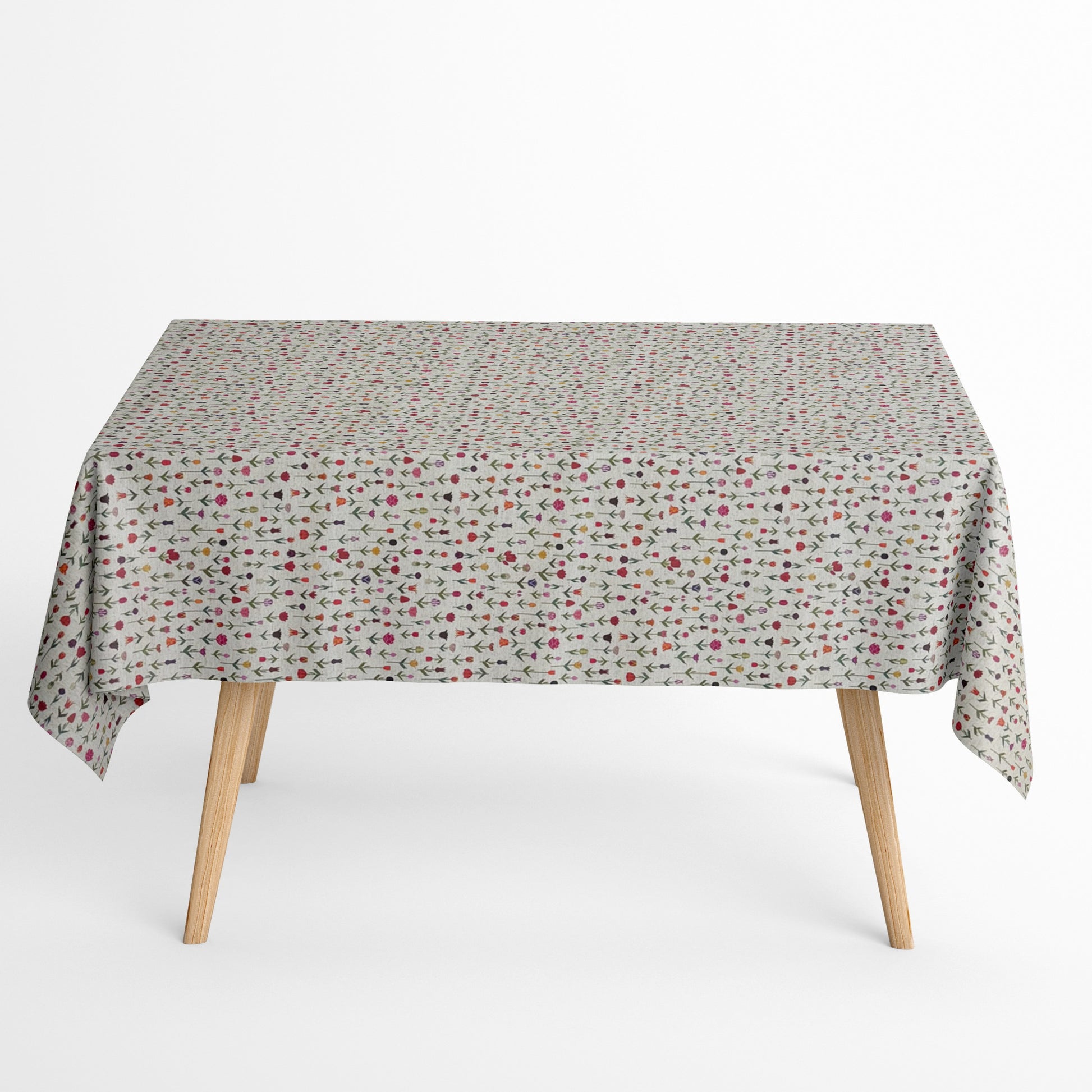 Beschichtete Jacquard-Baumwolltischdecke mit zartem Streublumenmuster aus kleinen bunten Blüten auf naturfarbenem Hintergrund, fleckengeschützt und schmutzabweisend.