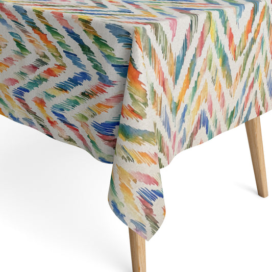 Beschichtete Jacquard-Baumwolltischdecke mit farbenfrohem Aquarellmuster aus dynamischen Pinselstrichen in Blau, Grün, Gelb, Orange und Rosé, fleckengeschützt und schmutzabweisend.