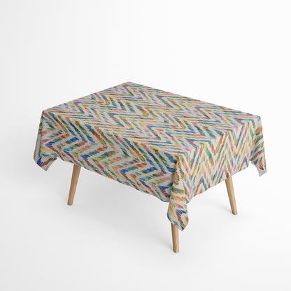 Beschichtete Jacquard-Baumwolltischdecke mit farbenfrohem Aquarellmuster aus dynamischen Pinselstrichen in Blau, Grün, Gelb, Orange und Rosé, fleckengeschützt und schmutzabweisend.