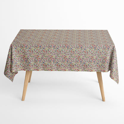 Beschichtete Jacquard-Baumwolltischdecke mit dichtem Streublumenmuster aus kleinen Blüten und feinen Ranken in Rosa, Koralle, Gelb, Grün und Violett auf naturfarbenem Hintergrund, fleckengeschützt und schmutzabweisend.