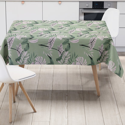 Wachstuch-Tischdecke mit tropischem Blättermuster auf mintgrünem Hintergrund. Weiße, graue und grüne Blätter mit feinen schwarzen Konturen sind gleichmäßig verteilt und erzeugen ein modernes, frisches Naturdesign.