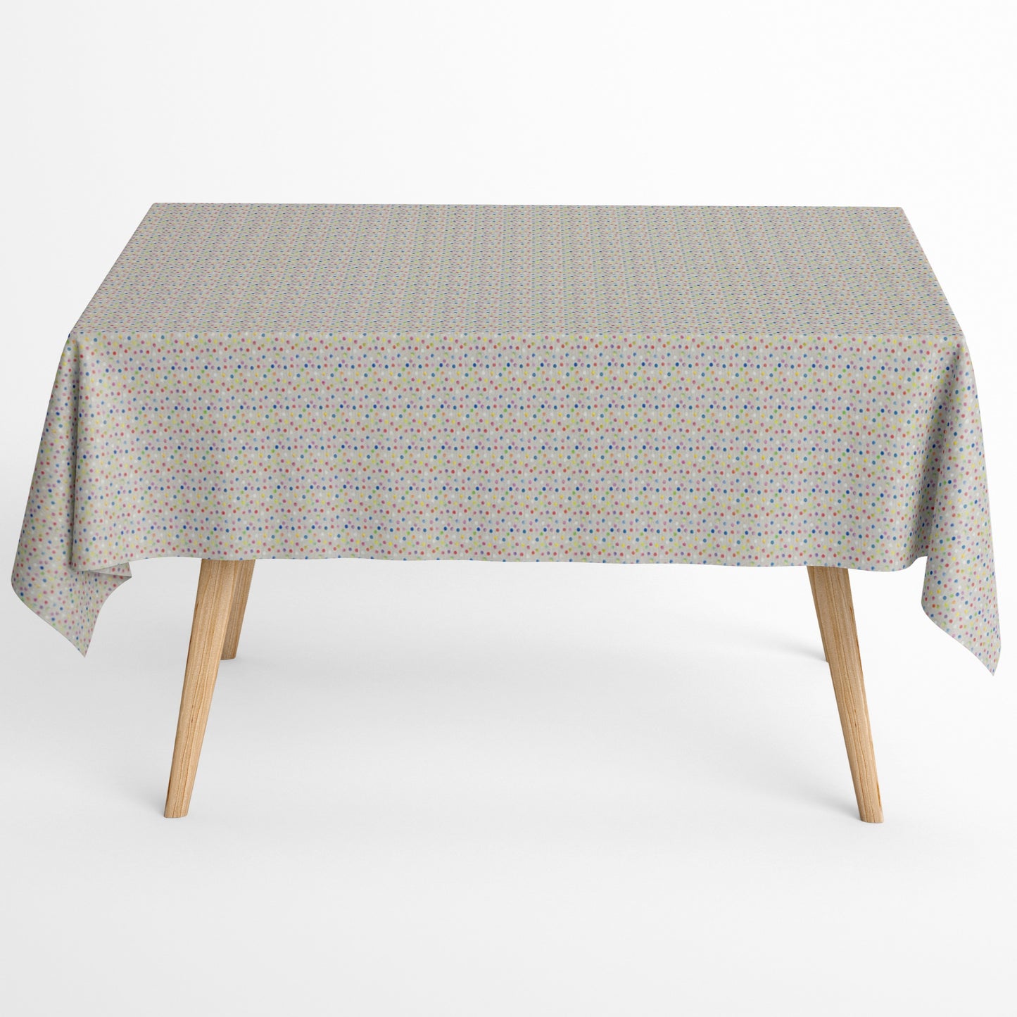 Jacquard-Tischdecke aus beschichteter Baumwolle mit hellem Grund und feinem, buntem Punktmuster in Blau, Rosa, Rot, Gelb, Grün, Orange und Violett.
