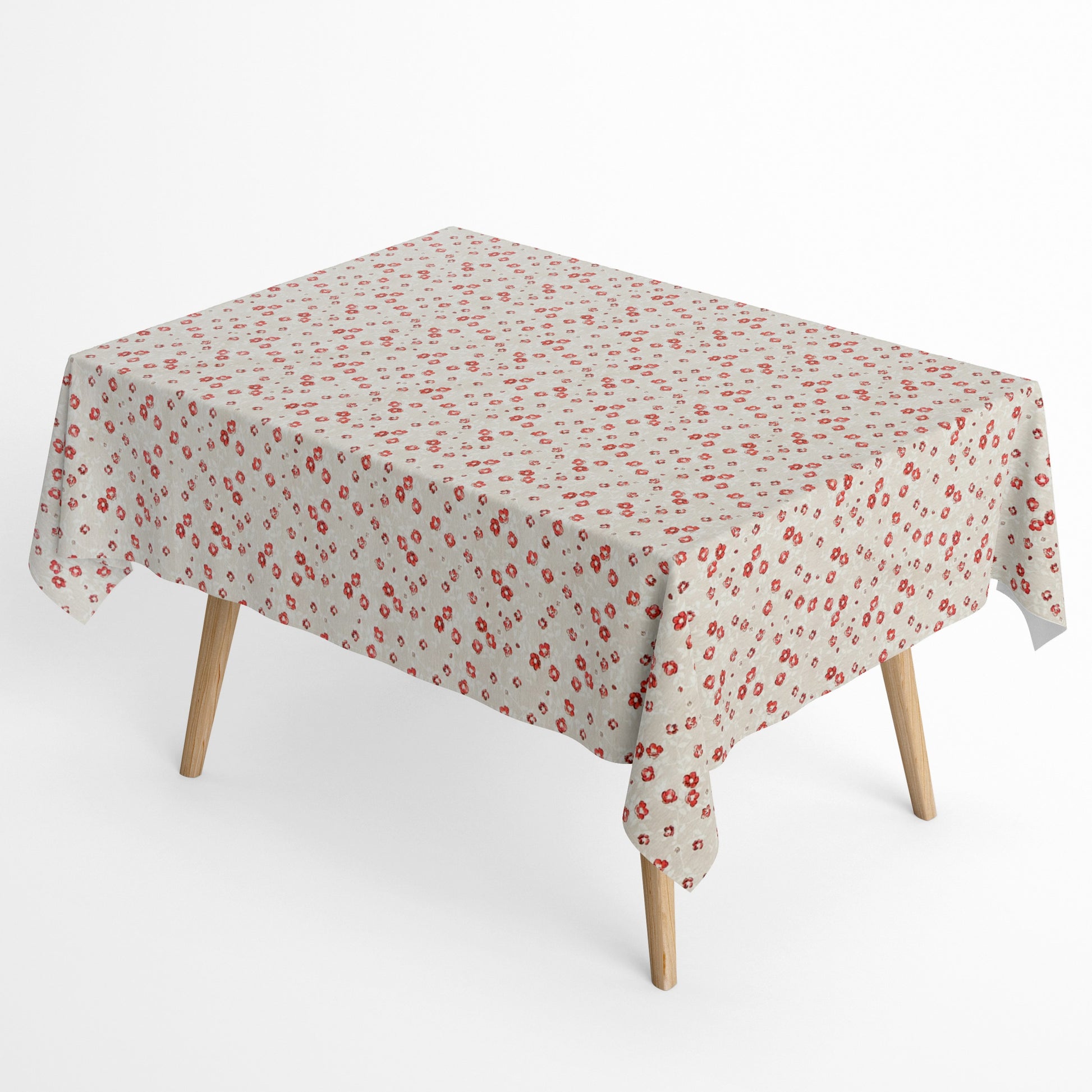 Die Jacquard Tischdecke aus beschichteter Baumwolle zeigt ein feines Streublumenmuster mit kleinen roten Blüten auf hellem, leicht strukturiertem Hintergrund.