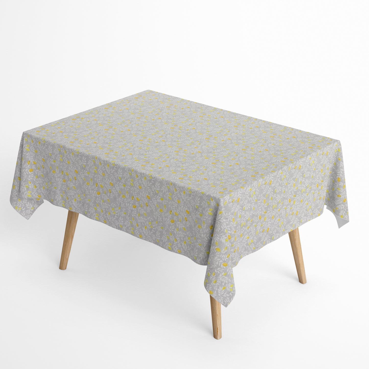 Die Jacquard Tischdecke aus beschichteter Baumwolle zeigt ein feines, dichtes Allover-Muster aus kleinen Zitronen und zarten Blättern in Gelb- und Grautönen.